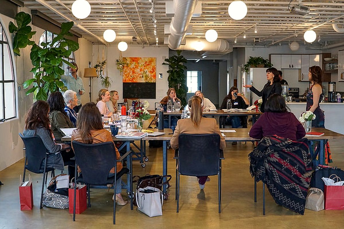 Owners working at tables during a live workshop session